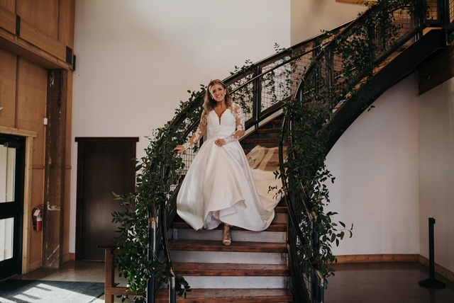 Large wedding with vining greenery on staircase. Ever Blooming Floral, Puyallup, WA.